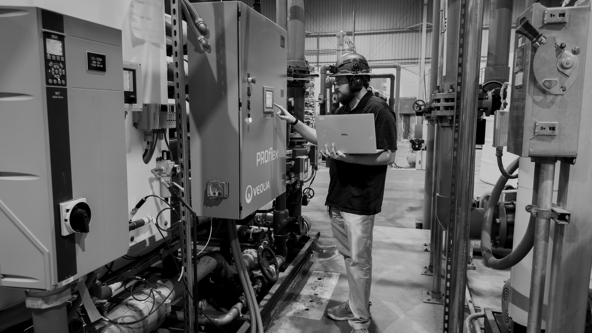 Engineer at a membrane skid control panel